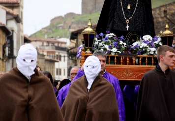 The First Glimpse of the Men in White Masks (and the float of Mourning Mary)