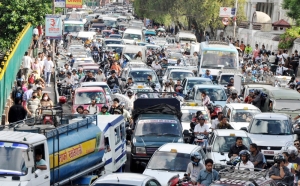 The South Asian Roads are a Veritable Sea of Cars, Trucks, and Bikes...
