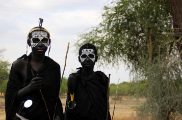 These two Maasai boys are about to be circumsized (hence the face-painting and black clothing)...